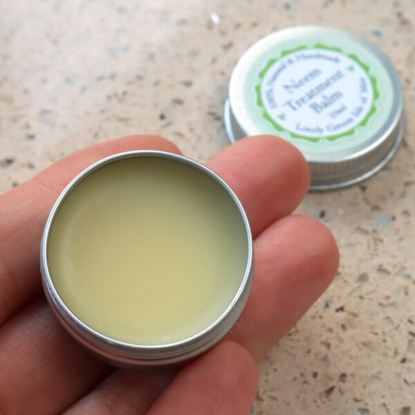 Inside the Neem Treatment Balm tin is a creamy salve made with neem oil and other conditioning oils